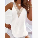 Haut pour femme colle en V, avec appliqués décoratifs.